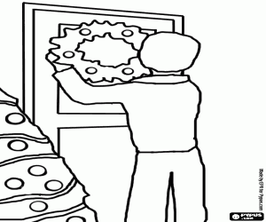 Coloriage Homme en accrochant la couronne de No�l dans la porte de sa maison