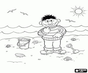 Coloriage Ernie à jouer avec le sable sur la plage