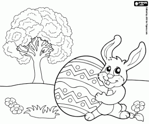 Coloriage Lapin, oeuf de pâques dans le jardin