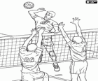 Attaque sur le filet et la tentative de bloquer la défense dans un match de volley-ball