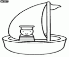 Petit bateau à voile avec le marin