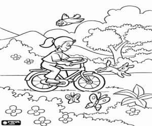 Coloriage Une fille avec un vélo au printemps